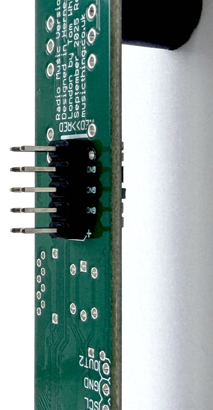 Side view of the power header sitting flush on the Radio Music PCB